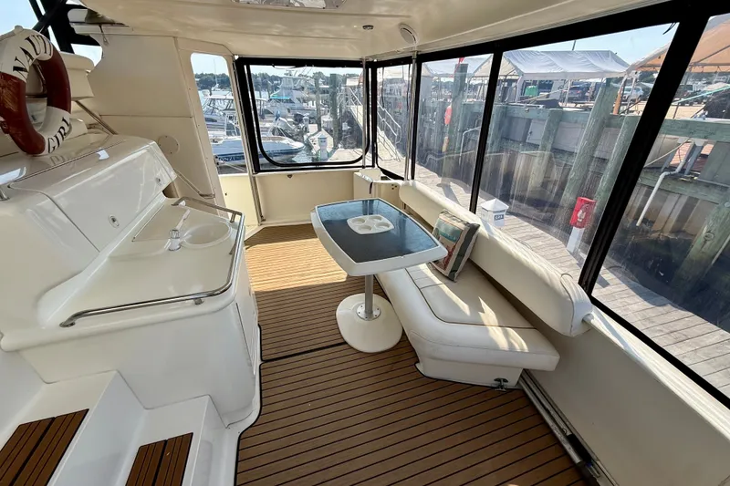 Slide: The Image of Interior of 2000 Sea Ray 380 Aft Cabin yacht with seating and table. - 4