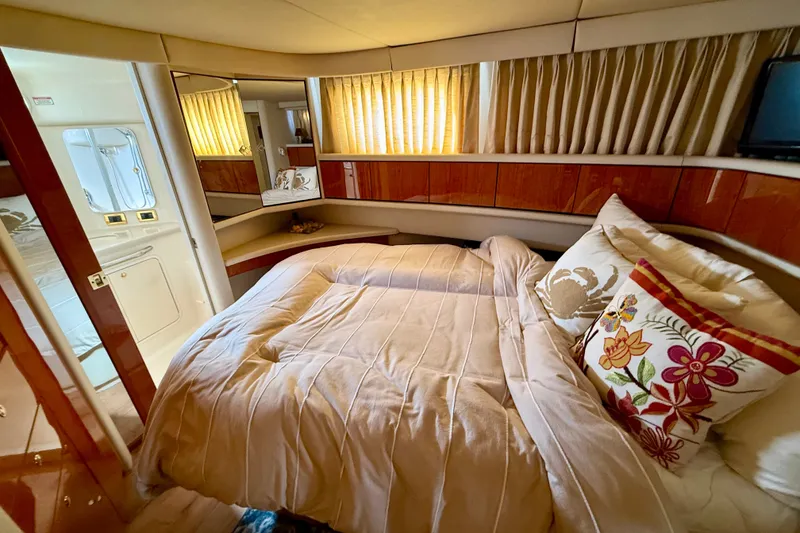 Slide: The Image of Luxurious cabin interior of 2000 Sea Ray 380 Aft Cabin yacht with cozy bedding. - 13