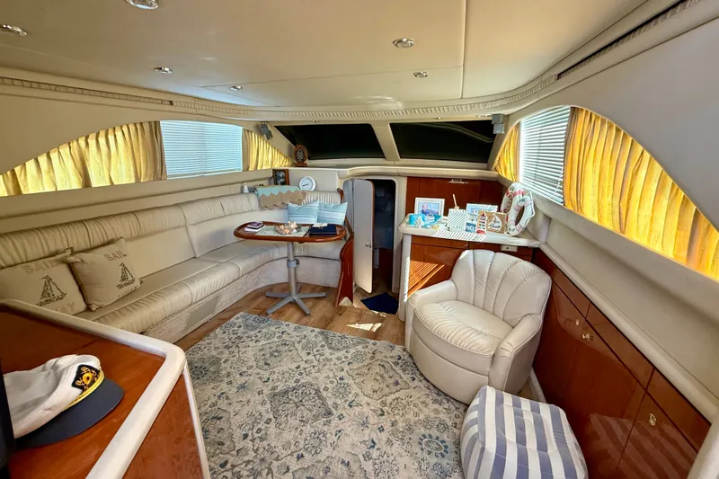 Slide: The Image of Luxurious interior of a 2000 Sea Ray 380 Aft Cabin yacht with elegant seating and decor. - 5
