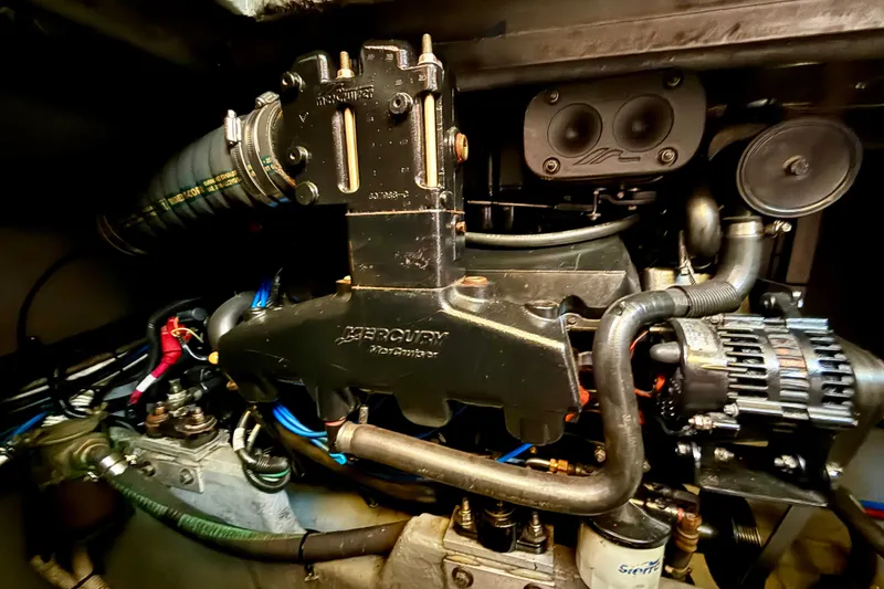 Slide: The Image of Engine compartment of a 2000 Sea Ray 380 Aft Cabin boat, featuring Mercury components. - 19