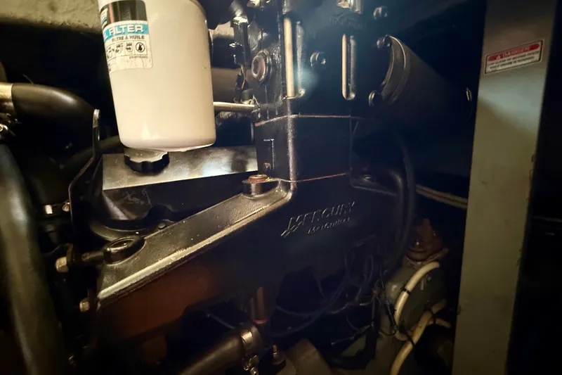 Slide: The Image of Engine compartment of a 2000 Sea Ray 380 Aft Cabin boat, featuring Mercury components. - 18