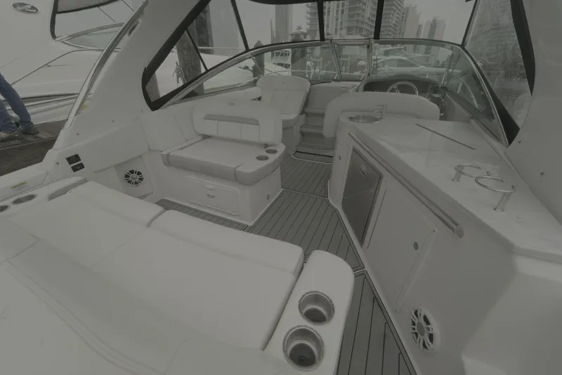 Slide: The Image of 2021 Regal 33 XO yacht interior with luxurious seating and modern amenities. - 14