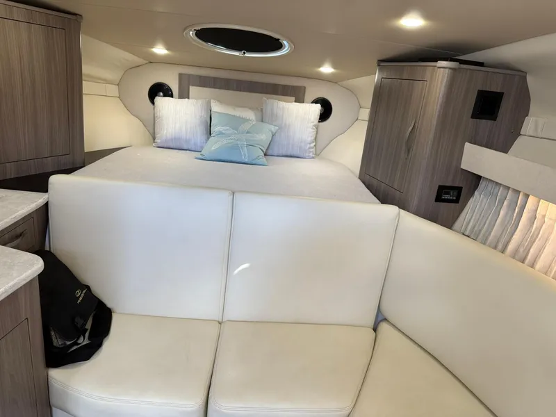 Slide: The Image of Luxurious interior of 2021 Regal 33 XO yacht with cozy bed and seating area. - 16