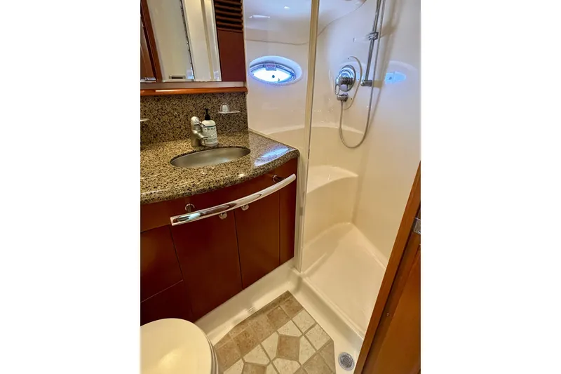 Slide: The Image of Luxurious bathroom in 2006 Sea Ray 52 Sundancer yacht with granite countertop and shower. - 36