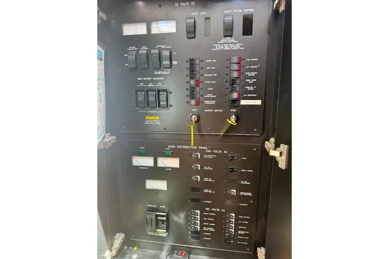 Slide: The Image of Electrical control panel of a 2006 Sea Ray 52 Sundancer yacht. - 62