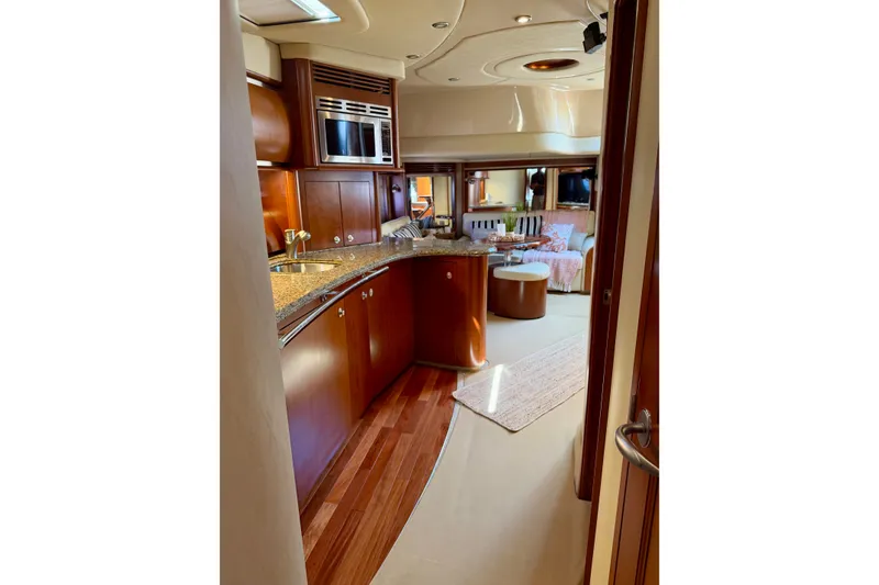 Slide: The Image of Luxurious interior of 2006 Sea Ray 52 Sundancer yacht with elegant wood finishes and modern amenities. - 40