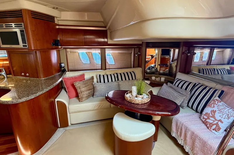 Slide: The Image of Luxurious interior of a 2006 Sea Ray 52 Sundancer yacht with elegant seating and decor. - 43