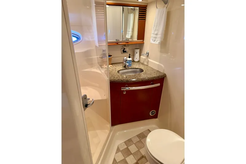 Slide: The Image of Luxurious bathroom in 2006 Sea Ray 52 Sundancer yacht with granite countertop and modern fixtures. - 38