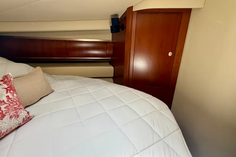 Slide: The Image of Luxurious cabin interior of 2006 Sea Ray 52 Sundancer yacht with elegant wood finish. - 34