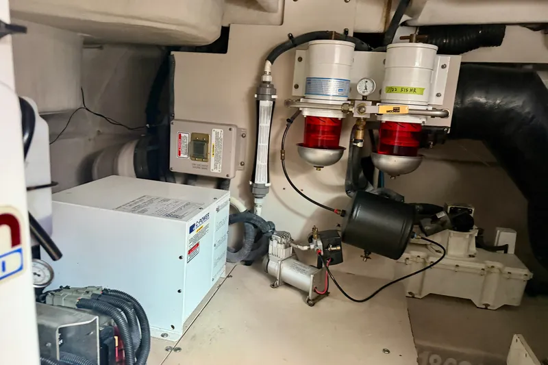 Slide: The Image of Engine room of 2006 Sea Ray 52 Sundancer with fuel filters and generator. - 56