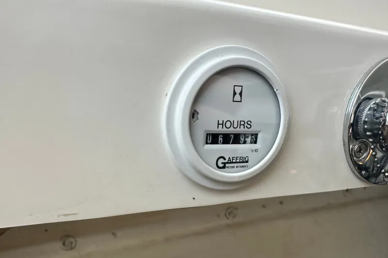 Slide: The Image of Hour meter reading 679.6 on 2001 Fountain 29 Fever boat dashboard. - 20