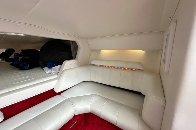 Slide: The Image of Interior of 2001 Fountain 29 Fever boat with white seating and red carpet. - 15