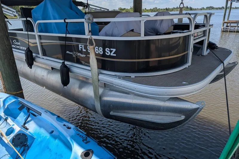The Image of 2021 Sun Tracker Bass Buggy 16 XL pontoon boat docked by the water. - 8