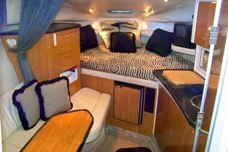 Slide: The Image of Interior of 2002 Regal Commodore 2860 boat with cozy cabin and modern amenities. - 3