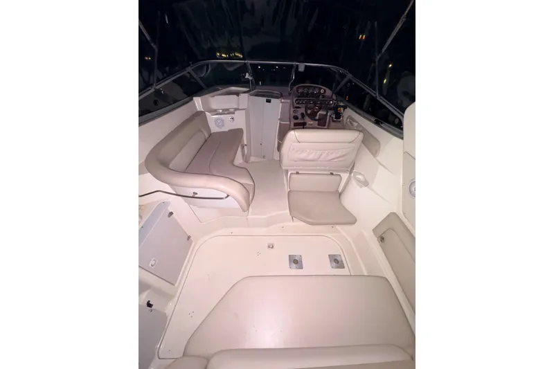 Slide: The Image of 2002 Regal Commodore 2860 boat interior with beige seating and control panel. - 8