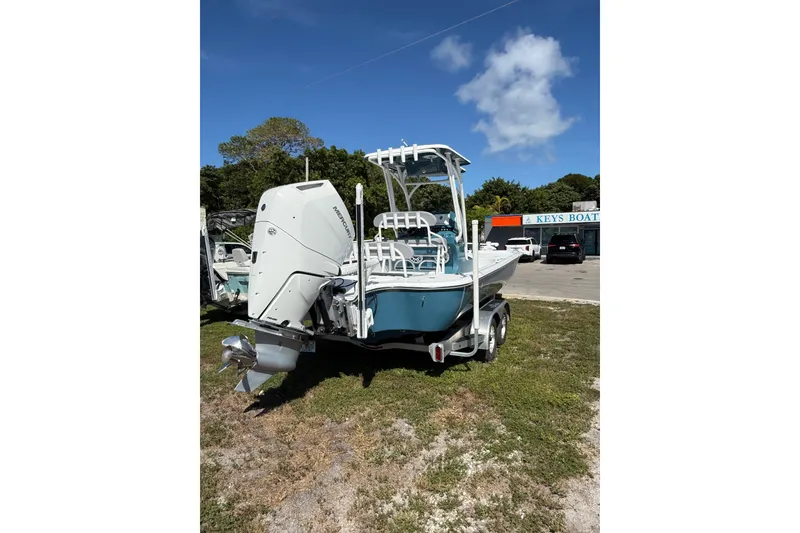 Slide: The Image of Turner Boatworks 2500 VS 2025 model on trailer, parked outdoors under clear sky. - 3