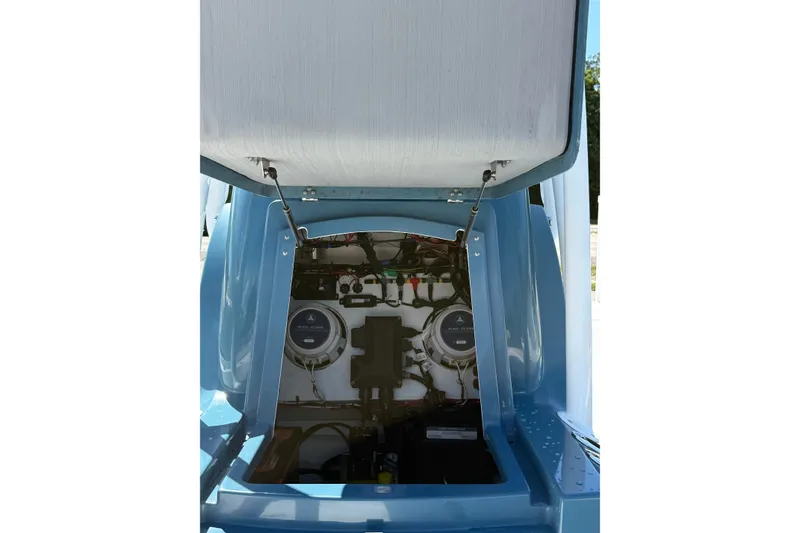 Slide: The Image of Open hatch of 2025 Turner Boatworks 2500 VS, revealing internal wiring and components. - 10