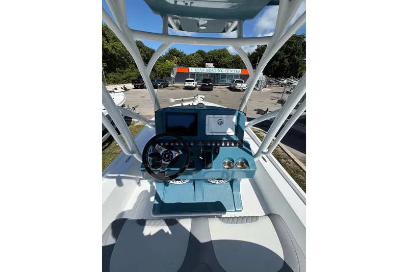 Slide: The Image of 2025 Turner Boatworks 2500 VS helm with modern controls at Keys Boating Center. - 7