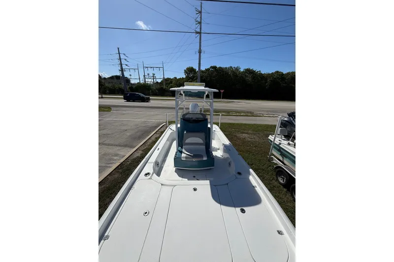 Slide: The Image of 2025 Turner Boatworks 2500 VS, sleek design, parked outdoors under clear blue sky. - 8