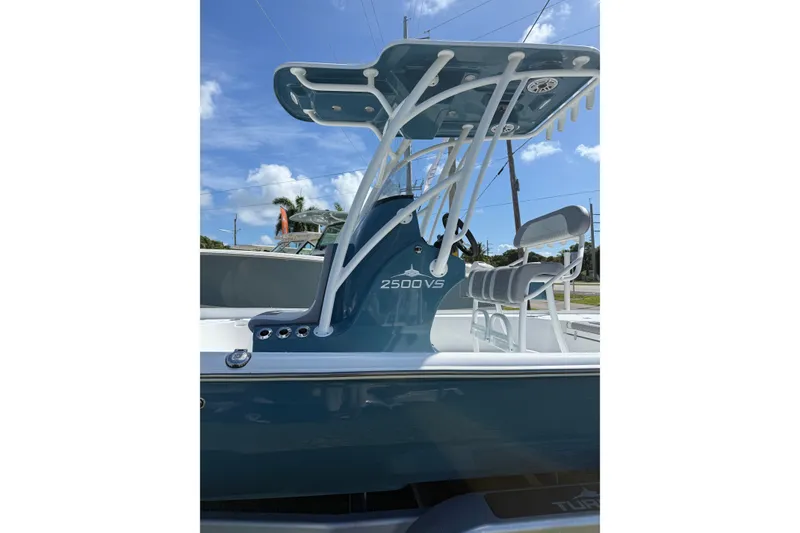 Slide: The Image of 2025 Turner Boatworks 2500 VS with sleek design and modern features under a clear sky. - 4
