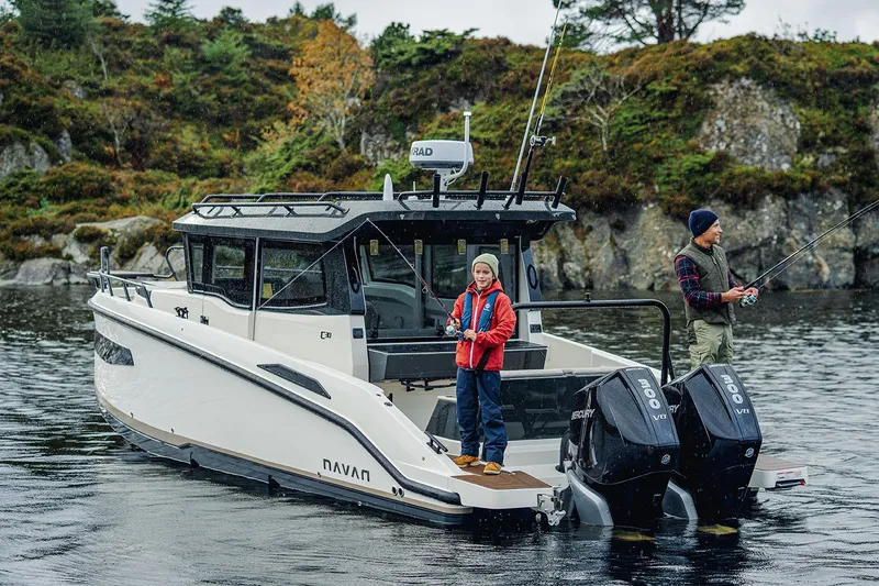 Slide: The Image of Manufacturer Provided Image: 2026 Navan C30 boat with two people fishing in scenic waters. - 3