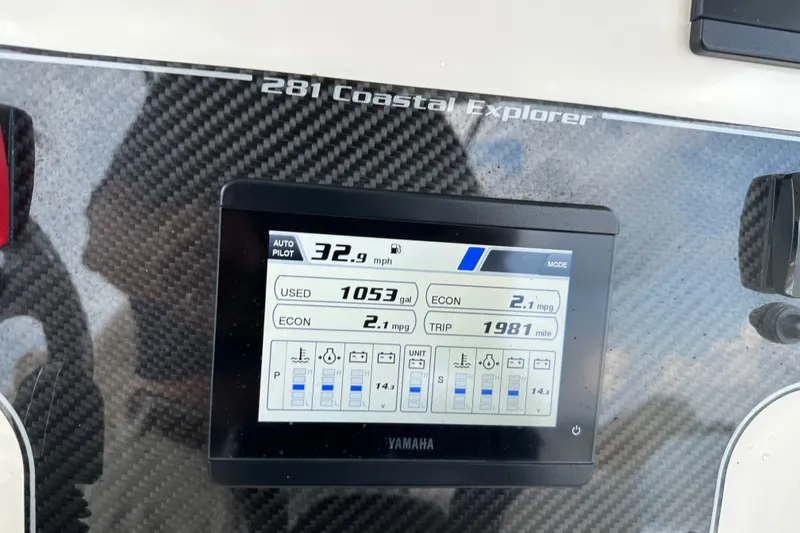 Slide: The Image of Dashboard of 2023 Grady-White 281 Coastal Explorer showing speed and fuel economy. - 22
