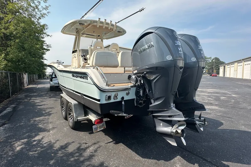 Slide: The Image of 2023 Grady-White 281 Coastal Explorer boat with dual Yamaha engines on a trailer. - 4