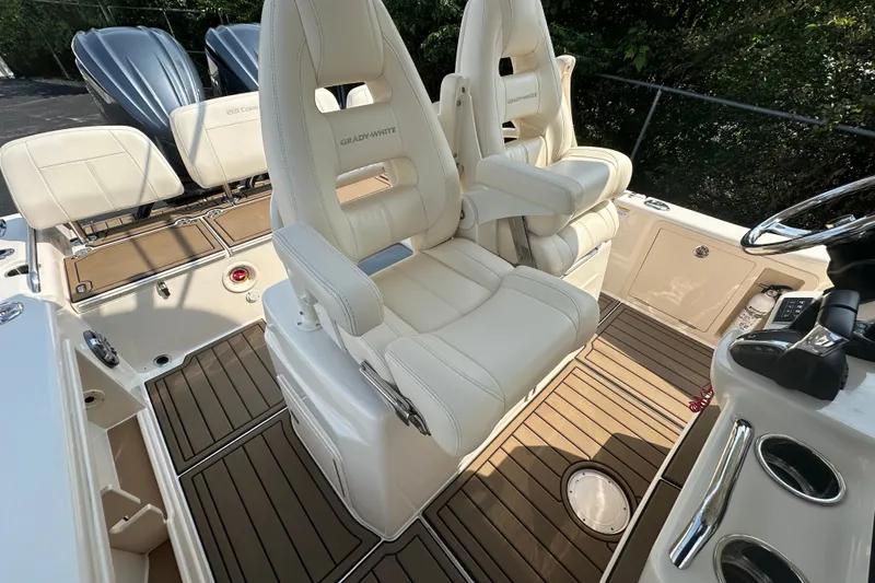 Slide: The Image of 2023 Grady-White 281 Coastal Explorer boat interior with luxurious seating and modern design. - 38
