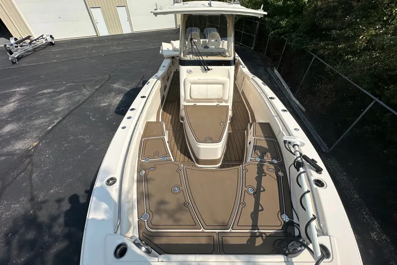 Slide: The Image of 2023 Grady-White 281 Coastal Explorer boat with spacious deck and modern design. - 11