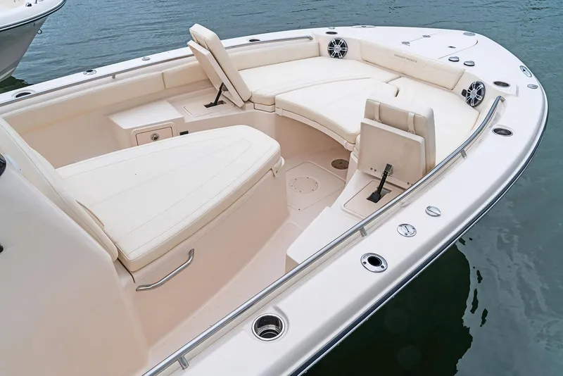 Slide: The Image of Manufacturer Provided Image: 2023 Grady-White 281 Coastal Explorer boat interior with cushioned seating and storage compartments. - 48