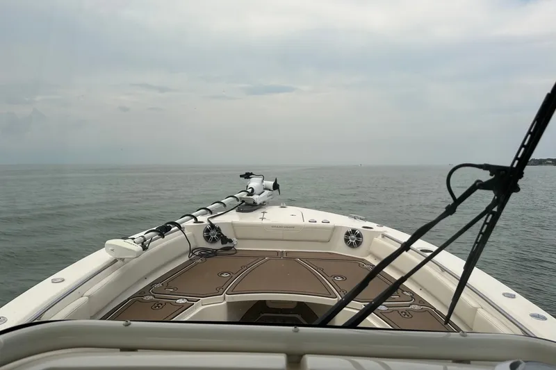 Slide: The Image of 2023 Grady-White 281 Coastal Explorer boat on open water, overcast sky. - 18