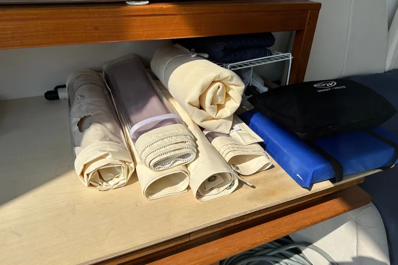Slide: The Image of Rolled boat covers and accessories on a Grady-White 281 Coastal Explorer, 2023 model. - 26