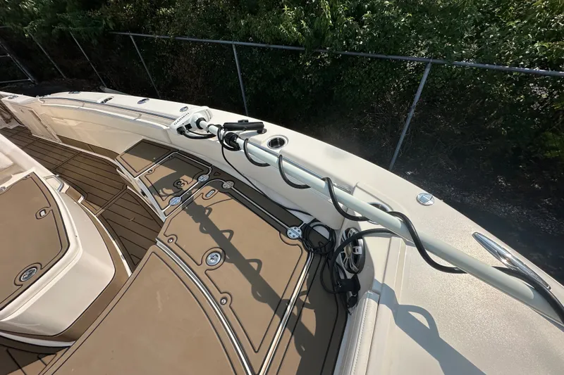 Slide: The Image of 2023 Grady-White 281 Coastal Explorer boat deck with fishing rod holder and storage compartments. - 15