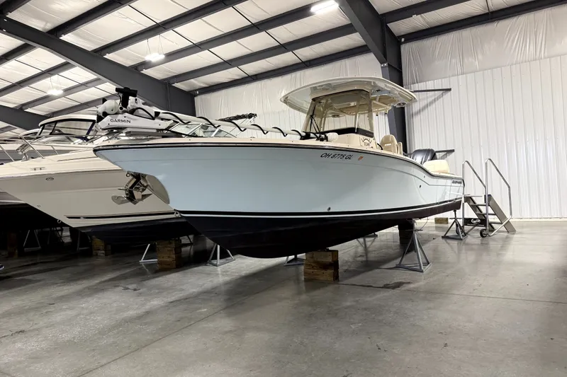 Slide: The Image of 2023 Grady-White 281 Coastal Explorer boat in indoor storage facility. - 9