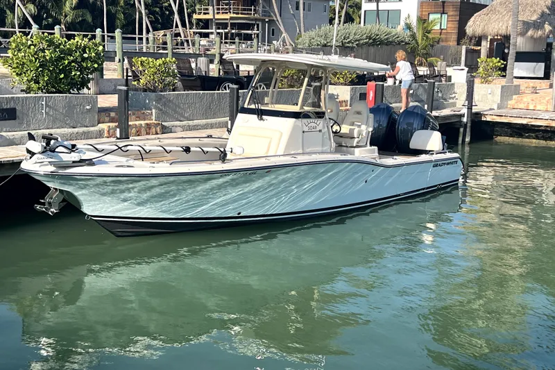 Slide: The Image of 2023 Grady-White 281 Coastal Explorer boat docked in a sunny marina. - 8