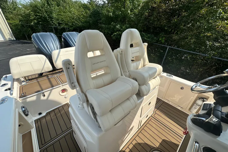 Slide: The Image of 2023 Grady-White 281 Coastal Explorer boat interior with luxurious seating and dual engines. - 39
