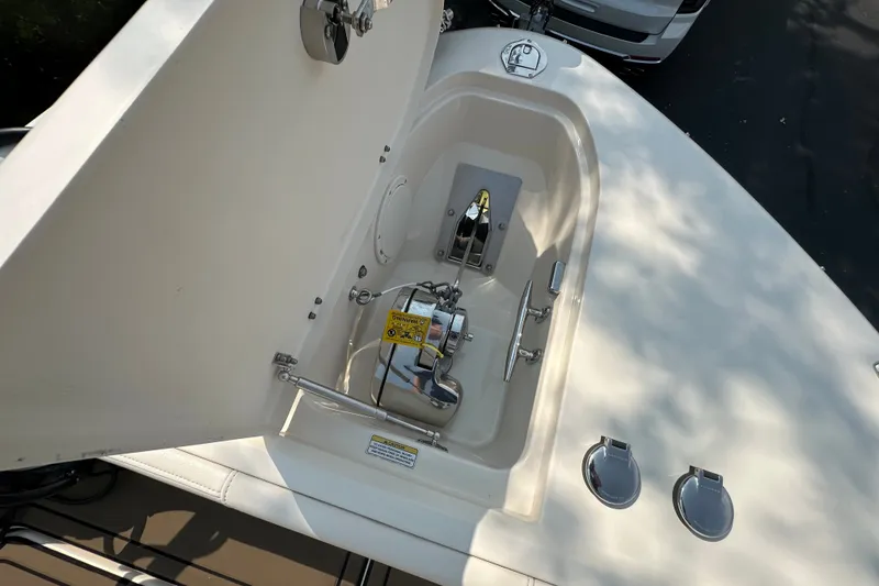 Slide: The Image of 2023 Grady-White 281 Coastal Explorer boat anchor compartment with open hatch. - 17