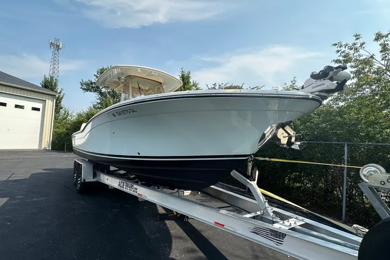 Slide: The Image of 2023 Grady-White 281 Coastal Explorer boat on trailer, parked outdoors. - 3