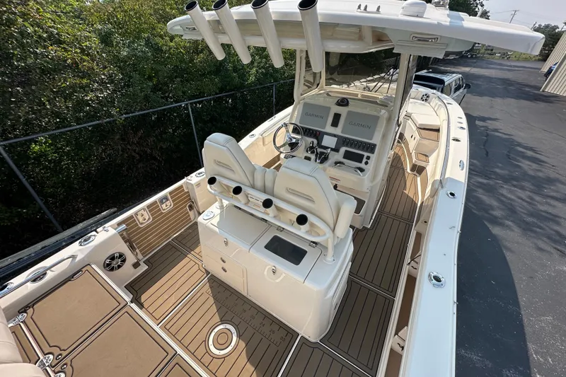 Slide: The Image of 2023 Grady-White 281 Coastal Explorer boat interior with advanced Garmin navigation system. - 10