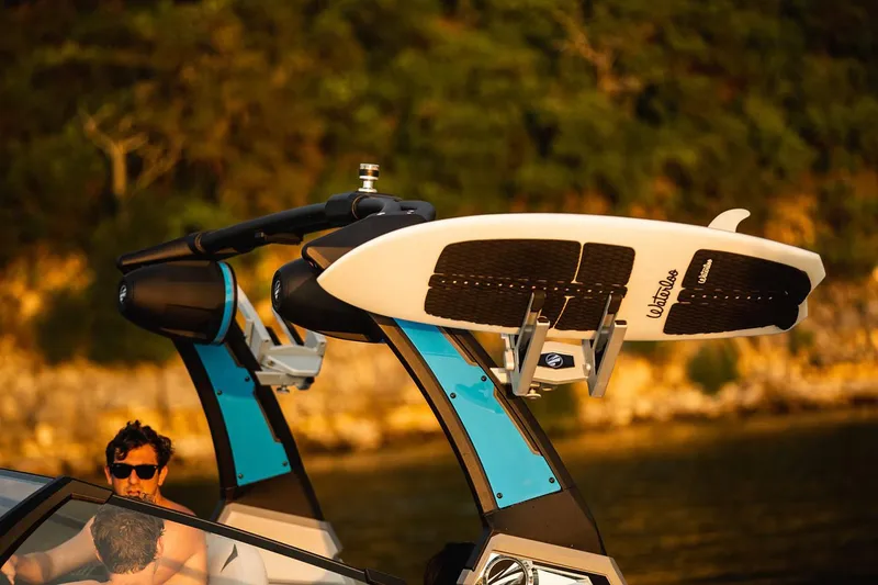 Slide: The Image of Manufacturer Provided Image: 2020 Tigé 23ZX boat with surfboard rack in scenic setting. - 18