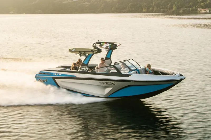 Slide: The Image of Manufacturer Provided Image: 2020 Tigé 23ZX boat speeding on a lake with passengers. - 14
