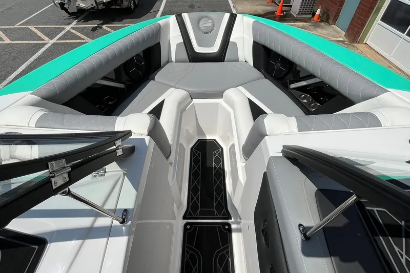Slide: The Image of 2020 Tigé 23ZX boat interior with gray seating and teal accents, showcasing luxury design. - 9