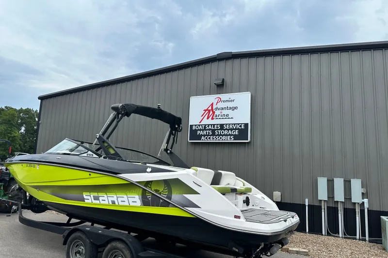 Slide: The Image of 2017 Scarab 255 boat at Premier Advantage Marine dealership. - 2