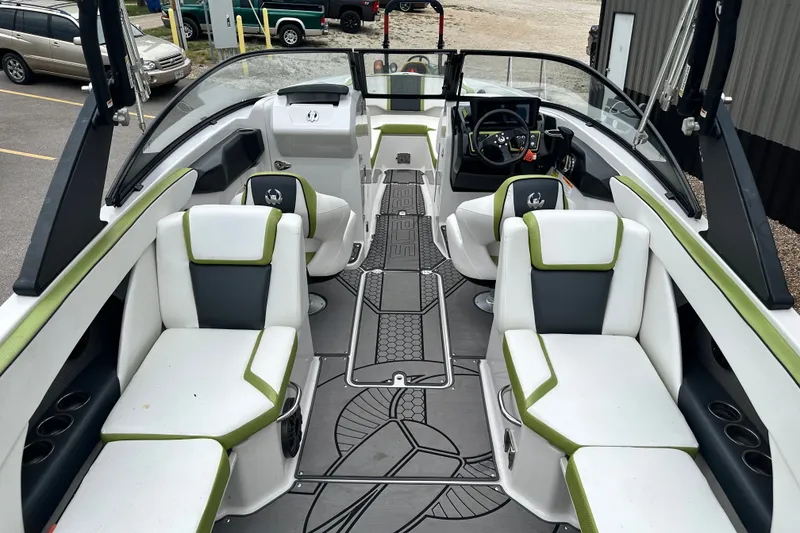 Slide: The Image of Interior of a 2017 Scarab 255 boat with stylish seating and modern dashboard. - 7