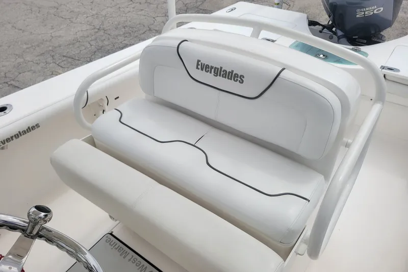 Slide: The Image of 2010 Everglades 243 Center Console boat with white seating and Yamaha 250 engine. - 16