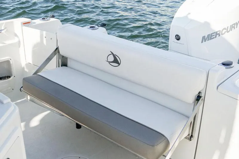Slide: The Image of Manufacturer Provided Image: 2026 Finseeker 220 CC boat with white seating and Mercury engine on water. - 8