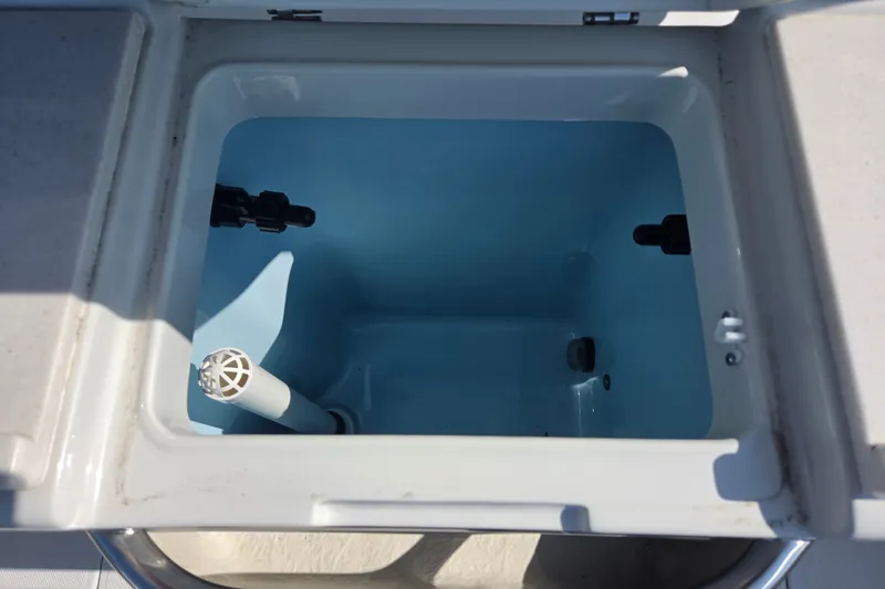 Slide: The Image of Livewell compartment in 2026 Finseeker 220 CC boat, featuring a clean, spacious interior. - 14