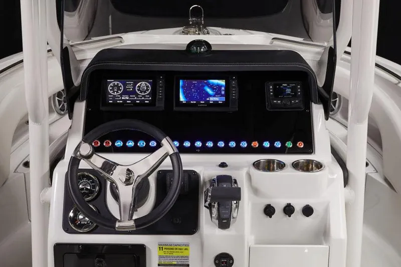 Slide: The Image of Manufacturer Provided Image: 2026 Finseeker 220 CC boat dashboard with modern controls and navigation screens. - 6