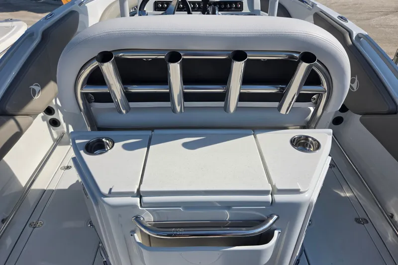 Slide: The Image of 2026 Finseeker 220 CC boat interior with rod holders and storage compartments. - 12