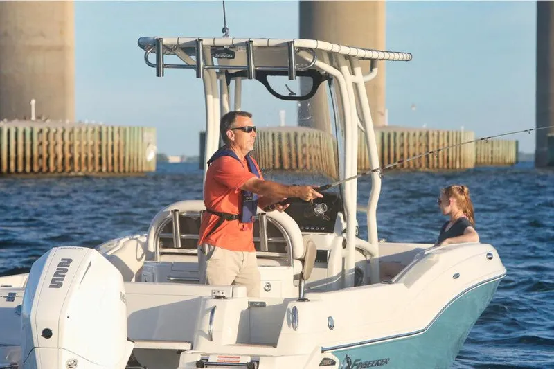 Slide: The Image of Manufacturer Provided Image: Man fishing on 2026 Finseeker 220 CC boat in open water. - 2